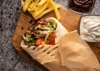 Chicken Doner Kebab with garlic sauce, BBQ sauce and fries
